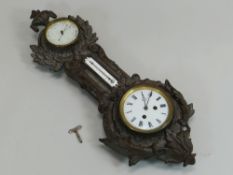 A CAST IRON FRAMED THERMOMETER, BAROMETER & CLOCK by Japy Freres and includes unusual 'Roamer' scale