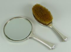 A SILVER BACKED HAIR BRUSH & MATCHING MIRROR of plain form