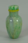 A JADEITE SNUFF BOTTLE OF BALUSTER FORM with stopper, believed circa 1800, 6.5cms high Provenance;