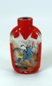 A CHINESE INSIDE-PAINTED GLASS SNUFF BOTTLE with red overlay, 7cms high