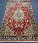 A RED & GREEN BRITISH WOVEN WOOL POLE RUG with traditional medallion design, 225 x 138cms