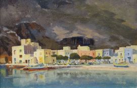 KENNETH HOLMES oil on board - beach front buildings with mountains in the background, 'Xlendigozo'