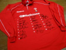 A SIGNED WALES RUGBY UNION JERSEY signed by twenty-two squad members circa 2002, donated by Ron