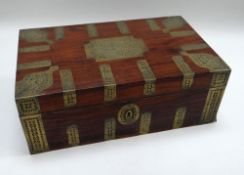 A COLONIAL BRASS MOUNTED LAP-DESK with twin carry-handles and two-stage compartmented interior,