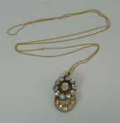 A VICTORIAN MOONSTONE PENDANT in the form of connected crescent and circle, in believed gold setting