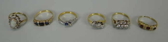 SIX VARIOUS GOLD RINGS comprising four 9ct including a diamond cluster and two 18ct with small