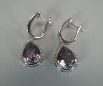 A MODERN PAIR OF CITRINE EARRINGS in diamond and white metal surround