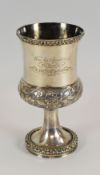 AN INTERESTING SILVER GOBLET of circular footed form with knopped body and funnel top, having raised