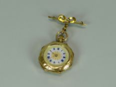 A 15K BRIGHT-CUT YELLOW GOLD OCGAGONAL FOB-WATCH with decorative enamel dial, Swiss made, with