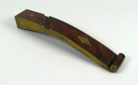 A NIINETEENTH CENTURY TREEN KNITTING SHEATH of curved form and mounted with brass to the edges and
