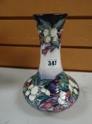 Modern Moorcroft tube lined floral vase of short squat form with long narrow neck, initialled and