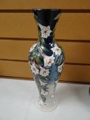 Modern Moorcroft tube lined floral vase of baluster form with narrow neck, signed and dated 2003