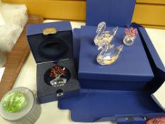 Two boxed Swarovski crystal glass flower arrangements together with another unboxed hanging coloured