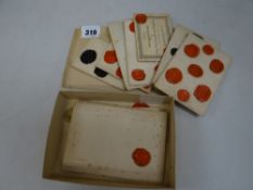 Collection of wax seals circa 1800s, in an old tobacco box