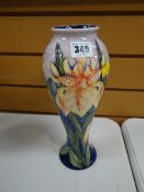 Modern Moorcroft tube lined floral vase of baluster form, signed with initials and dated 2000