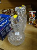 Three cut glass decanters