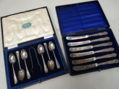 Cased set of six silver tea knives together with a cased silver spoon and tong set