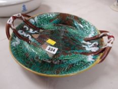 Majolica naturalistic bread dish and a pair of claret jugs