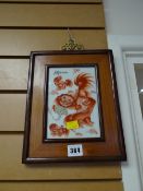 Framed Oriental glazed tile with temple dogs