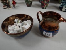 Two items of copper lustre and a quantity of collectable thimbles