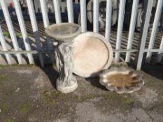 Modern composite Three Graces bird bath together with a floorstanding shell bird bath and another (
