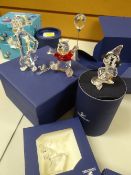 Four boxed Swarovski crystal glass Disney characters including Winnie the Pooh etc