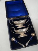 Cased Birmingham silver twin handled cruet set