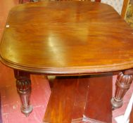 A VICTORIAN MAHOGANY WIND-OUT TABLE with one full and two extra half leaves, the top with moulded