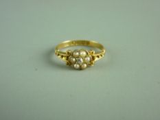 AN EIGHTEEN CARAT GOLD DRESS RING with centre tiny diamond and five surrounding seed pearls, 2.6