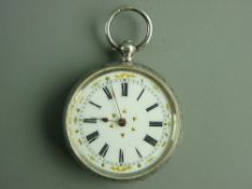 A LADY'S SILVER ENCASED FOB WATCH with attractive white enamel dial, Roman numerals and gilt