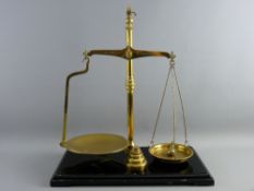 A SET OF AVERY SHOP SCALES to weigh one pound, with brass pans, a set of weights and on a black