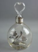 A SILVER OVERLAY GLASS SCENT BOTTLE with heart shaped stopper, the collar marked Birmingham 1900,