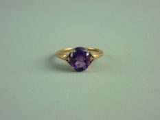 A NINE CARAT GOLD OVAL AMETHYST DRESS RING, 2.8 grms gross, size 'R/S'