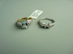 A NINE CARAT GOLD AQUAMARINE & DIAMOND DRESS RING, 3.7 grms gross, size 'N/O' and a nine carat white