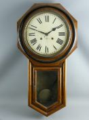 AN OAK ENCASED CIRCULAR DIAL PENDULUM WALL CLOCK with eight day striking movement by Seikosha,
