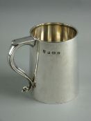 A SILVER PINT TANKARD of tapering form with shaped handle, inscribed 'John, With Love From Marjorie,
