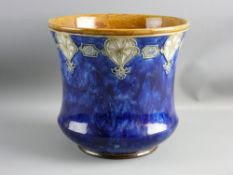A ROYAL DOULTON STONEWARE JARDINIERE, tube line decorated, stylized rim band on a mottled cobalt