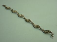 A BOXED 925 SILVER MACKINTOSH DESIGN BRACELET having six links, each link with a Mackintosh rose,