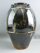 JIM MALONE (1946-) CONTEMPORARY POTTERY THREE HANDLED BULBOUS VASE decorated with a Tenmoku glaze on