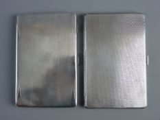 TWO GENT'S ENGINE TURNED SILVER CIGARETTE CASES, 6 troy ozs, Birmingham 1934 and 5.6 troy ozs,