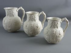 A GRADUATED SET OF THREE SEMI-GLAZED COMMEMORATIVE JUGS by William Brownfield circa 1860s, relief