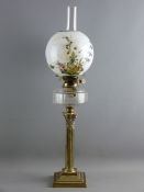 A CORINTHIAN COLUMN BRASS LAMP with a stepped square base, plain shaped glass reservoir and milk
