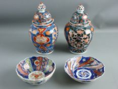 A PAIR OF LATE 19th/EARLY 20th CENTURY IMARI BALUSTER JARS with knopped covers, 20 cms high and