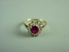A NINE CARAT GOLD CENTRE RUBY & TINY CZ CLUSTER RING, 2.2 grms, size 'O'