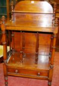 A VICTORIAN MAHOGANY WHATNOT CANTERBURY having a shelved back rail, a three sectional base shelf