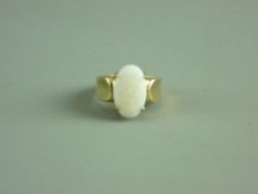 A NINE CARAT GOLD CLOUDY WHITE OPAL DRESS RING, 15 mm long, 5 grms gross, size 'O'