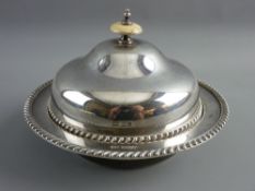 A CIRCULAR SILVER MUFFIN DISH with gadrooned border, interior liner dish and a slightly domed