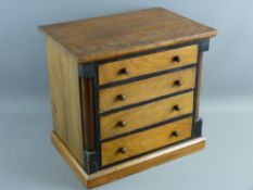 A CIRCA 1900 MAHOGANY & EBONIZED APPRENTICE CHEST of four long drawers with turned wooden knobs
