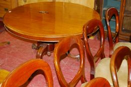 A VICTORIAN MAHOGANY CIRCULAR LOO TEA TABLE with centre turned column, 117 cms diameter together