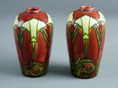 A PAIR OF MINTON SECESSIONIST VASES with stylized tube line decoration on a plum ground with ovoid